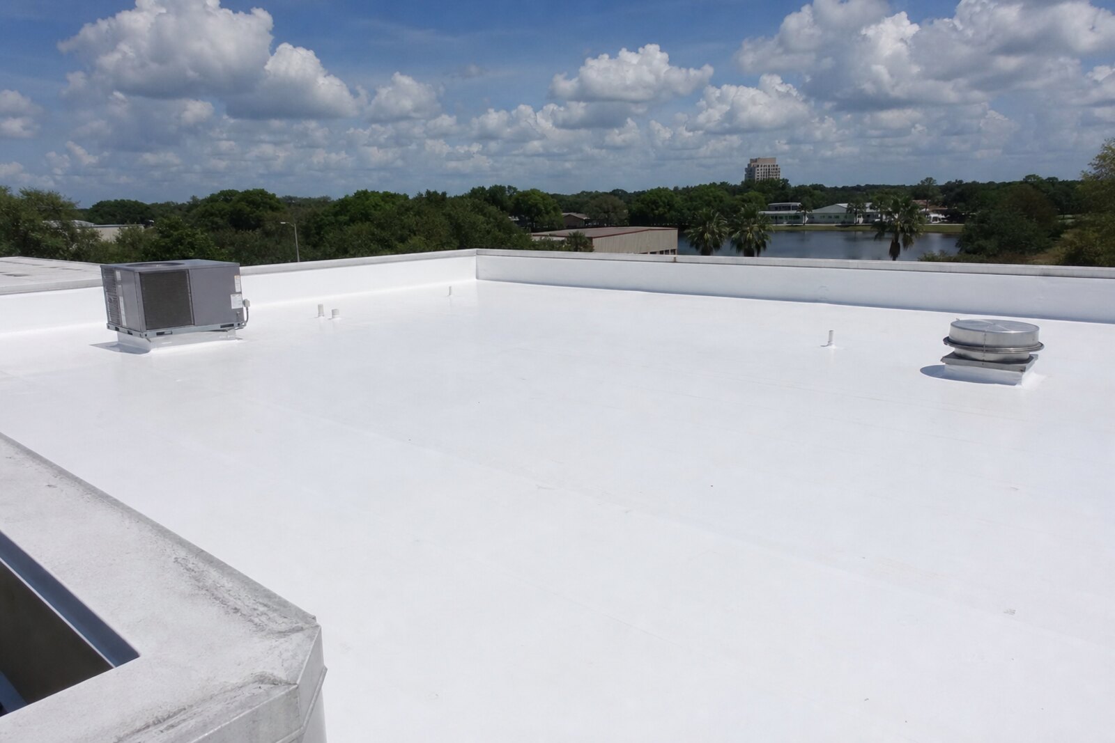 Lakeland commercial roof exterior with access and drainage details to review